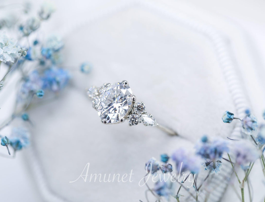 Engagement ring with Charles & Colvard oval moissanite paired with diamonds - Amunet Jewelry