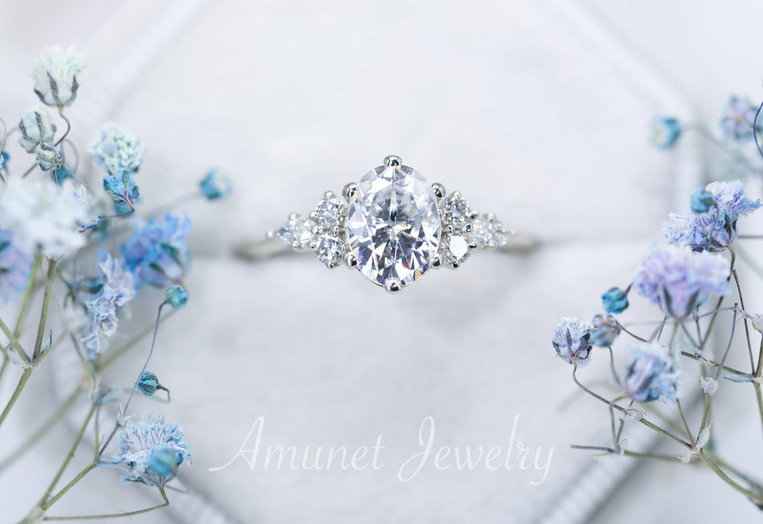 Engagement ring with Charles & Colvard oval moissanite paired with diamonds - Amunet Jewelry