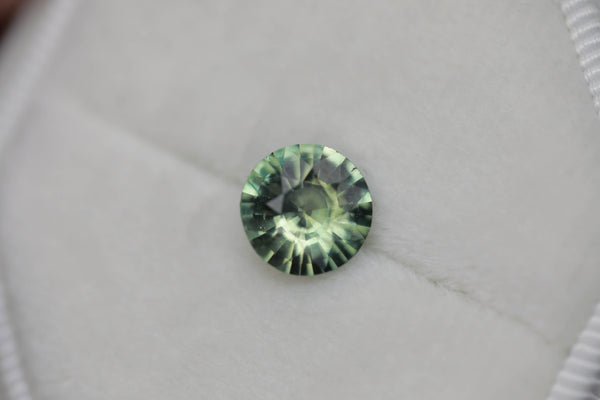 2.19 ct green yellow round parti sapphire