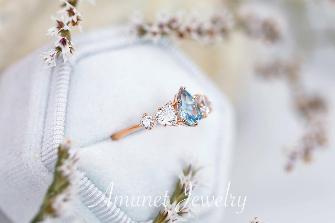 Engagement ring with a aquamarine and trillion moissanites, Charles & Colvard moissanites