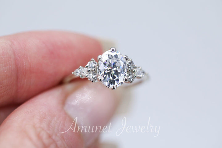 Engagement ring with Charles & Colvard oval moissanite paired with diamonds - Amunet Jewelry