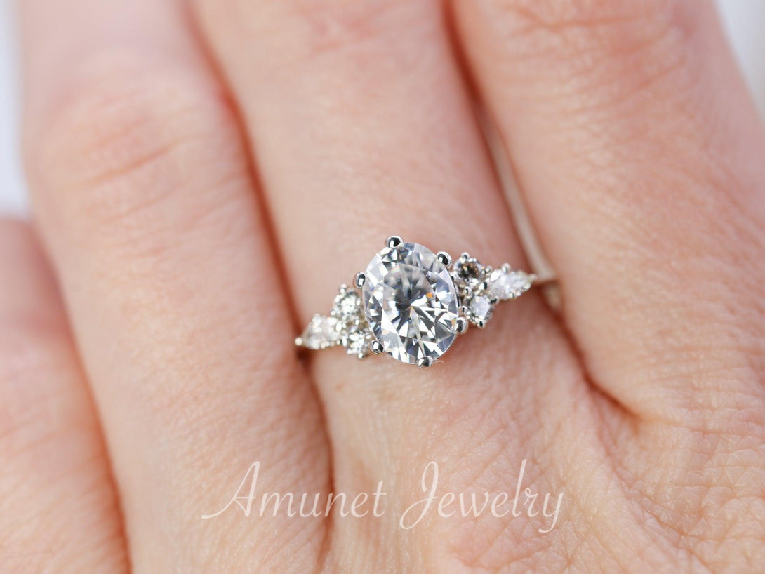 Engagement ring with Charles & Colvard oval moissanite paired with diamonds - Amunet Jewelry